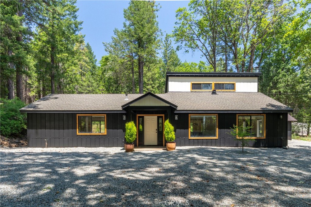 Ready to escape the valley heat? Nestled among the beautiful trees of Forest Ranch, this charming home offers a serene mountain retreat just under 30 minutes from Chico. Entire interior and exterior have been freshly painted. The main house boasts spacious three bedrooms and two full baths. The third full bathroom sits inside a quaint detached cottage that could be used as a fourth bedroom, office or in-law quarters. The home sits on fully fenced, well maintained 2.5 acres and features a large shop providing plenty of room to store all your toys or use as a garage. The shop is 25’x 35’ with double rolling doors in the front and a single door on the backside. A chicken coop and dog kennel add to the charm and it’s the perfect place for a small farm or homestead.
This home offers a spacious, peaceful living space, surrounded by nature’s beauty. Schedule your showing today!