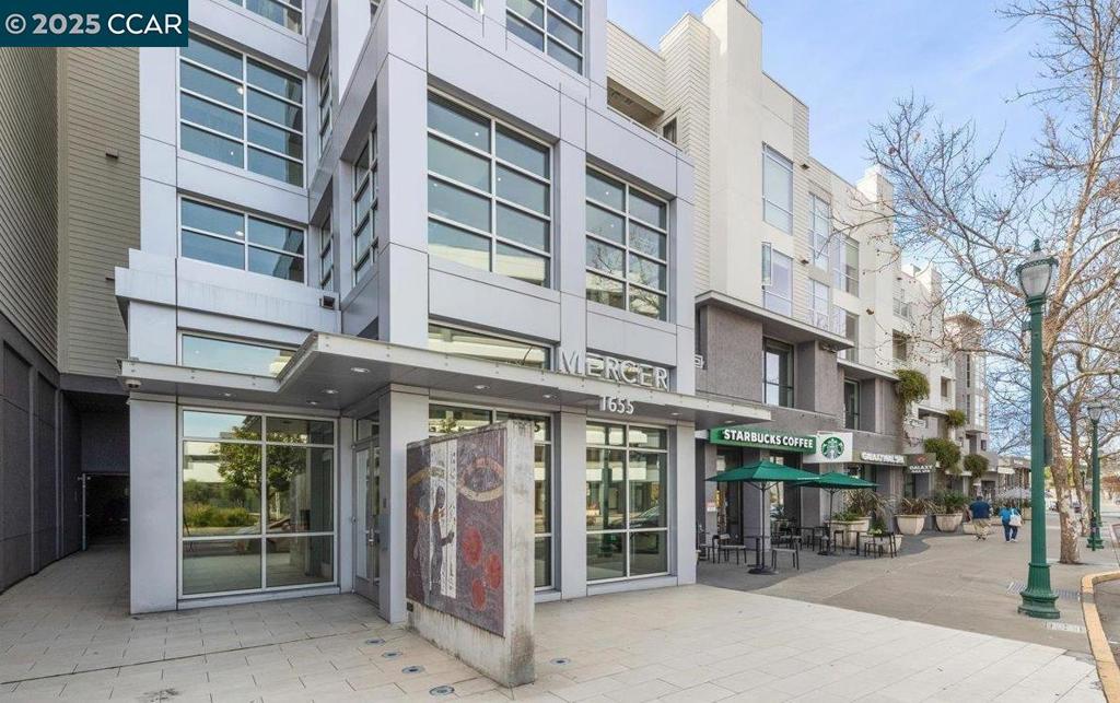 Are you Looking to live in downtown Walnut Creek? This exquisite second-floor unit at The Mercer offers the perfect blend of tranquility and sophistication. With a west-facing orientation, the unit is flooded with natural light, creating a bright and airy atmosphere throughout. This unit has beautiful views of the Berkley Hills and is surounded by bamboo but more importantly is very quiet. European oak floors, sleek Quartz countertops and backsplash, and high-end appliances, made by Bosch, and a Subzero refrigerator. The kitchen also features an upgraded utility sink. The living room with a custom porcelain surround gas fireplace, complemented by a stunning Restoration Hardware chandelier, creating a welcoming ambiance for relaxation or socializing. Hidden within the wall is a convenient Murphy bed. The Mercer offers unparalleled amenities, including a BBQ area, a fitness center, a gated entry, a spacious pool and spa, and a clubhouse. This unit also includes two private, gated, side by side parking spots and a dedicated storage area for your convenience. Ideally located, this home is just a short walk to the Walnut Creek BART station, providing seamless access to the greater Bay Area. Enjoy world-class dining and shopping at Broadway Plaza and Locust just steps from your door.