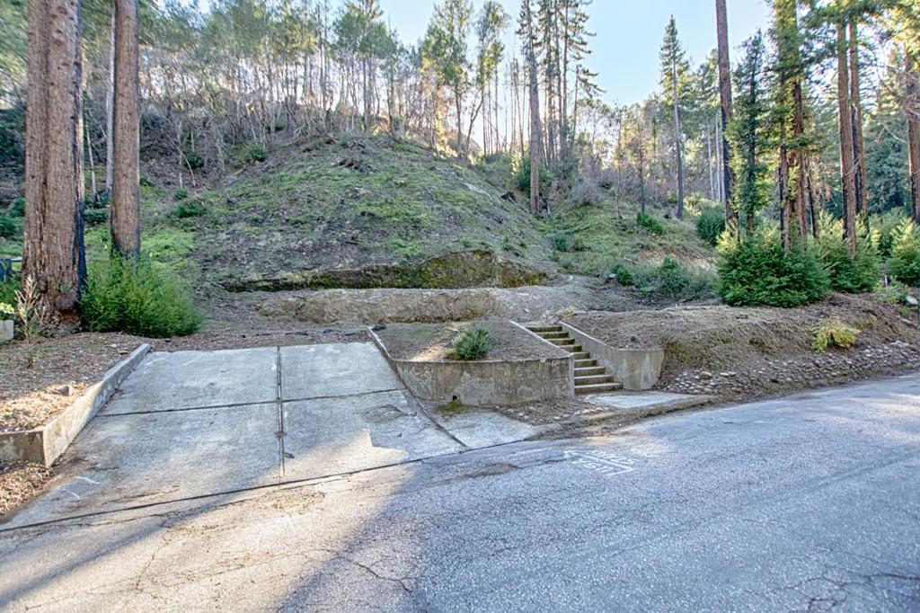 Build Your Dream Home in the Stunning Santa Cruz Mountains! Why start from scratch when you can build your dream home in one of Boulder Creeks most desirable neighborhoodswith plans and permits already in place? This exceptional property offers the perfect mix of peaceful mountain living and a welcoming community atmosphere, making it an ideal retreat for those seeking both tranquility and convenience. Just a short walk to the Boulder Creek Golf & Country Club and a quick drive to downtown dining, shopping, Big Basin Redwood State Park, and endless hiking and biking trails, this location puts you right in the heart of mountain recreation. The best part? The groundwork is already done for you! This sun-filled lot, previously home to a 3,000 sqft residence, is cleared and comes with approved plans and permitssaving you the time, money, and frustration of navigating the countys complex building process. With PG&E, sewer, cable, and cell service readily available, all thats left is to bring your vision to life. Dont let this rare opportunity pass you bystart building your dream home today in the stunning Santa Cruz Mountains!