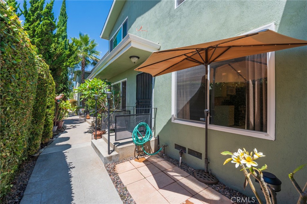 Tucked away at the rear of a charming complex, 326 Hermosa Ave #7 offers a peaceful retreat just blocks from Alamitos Beach. This beautifully updated 1-bedroom, 1-bath condo combines comfort, functionality, and coastal charm.
Step into a bright and inviting space with new tile flooring in the kitchen and dining area, along with a refreshed kitchen featuring newly painted cabinetry and brand-new appliances, including a gas range and refrigerator. The open-concept layout is perfect for both everyday living and entertaining, and the unit includes in-unit laundry for added convenience.
The bedroom includes a generous closet with updated shelving, while the bathroom offers a clean, timeless aesthetic. Enjoy a private outdoor patio area exclusive to Unit #7, perfect for morning coffee, evening reading, or relaxing with your pets. The walkway to the unit is lined with vibrant landscaping and a tranquil fountain, adding to the home's peaceful ambiance.
A semi-private garage—shared with just one neighboring unit—includes built-in storage, and the pet-friendly community features low HOA dues. Ideally located just minutes from 4th Street Retro Row, East Village Arts District, and local cafes, this move-in-ready gem is perfect for first-time buyers, downsizers, or anyone seeking a beach-close lifestyle in the heart of Long Beach.