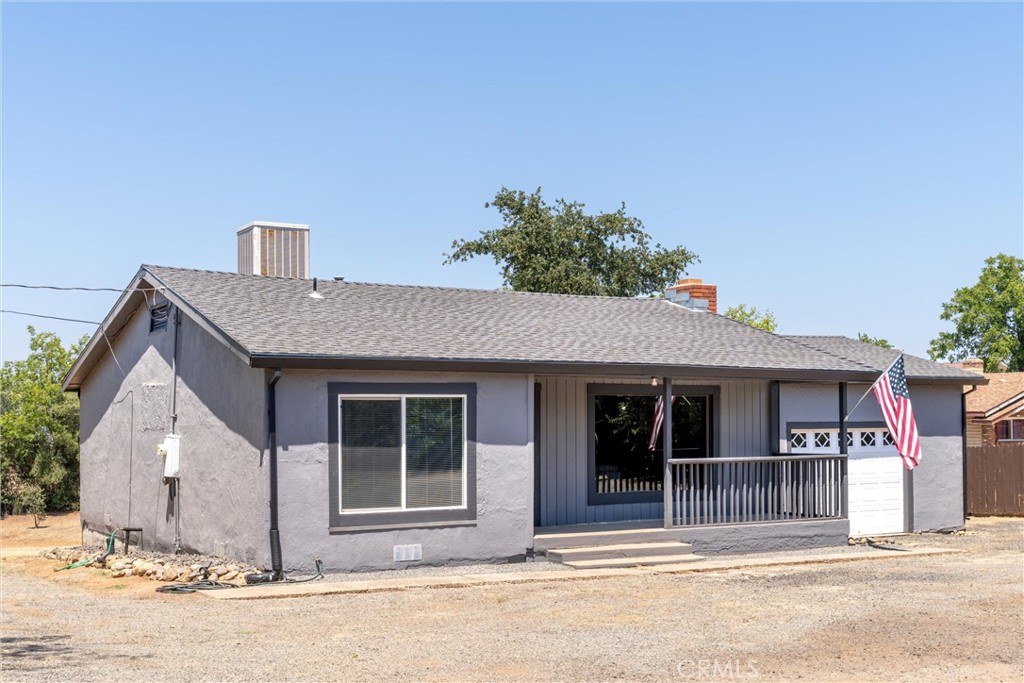 Welcome to this beautifully remodeled 2-bedroom, 1-bathroom home on a large, just over half an acre, corner lot. This home is very inviting and as you enter, you will be welcomed by the large living with a wood burning fireplace that flows right into the dining area and kitchen. This home boasts many upgrades including refinished hardwood floors, a new roof, updated kitchen and bathroom, fresh paint, and updated fixtures throughout. Laundry hookups are present just outside the kitchen in the attached garage. The garage is large and provides ample space for parking and storage. The yard is very private with a wood privacy fence around most of the perimeter. There is ample space for parking your vehicles and toys and the driveway has two gates making entering and exiting the property simple. Don't miss out on the opportunity to make this charming house your new home!