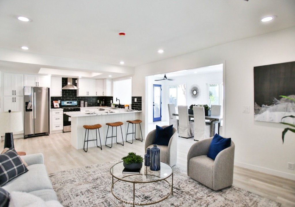 Don't miss this rare opportunity to own a beautifully upgraded and fully remodeled home in the heart of Tustin! This spacious 4-bedroom, 3-bathroom residence boasts 2,572 square feet of modern living space, thoughtfully designed with high-end finishes and attention to detail throughout: recessed lighting, soaring foyer, ceiling chandelier, custom glass stair railings, dual pane sliding doors and windows, laminate floor, glass door showers, and an expanded family room with ample natural light. Located in a wealthy neighborhood near a scenic golf course, top-rated schools, and nestled between Tustin Legacy and the vibrant Irvine Marketplace, it offers easy access to groceries, shopping, dining, and entertainment. Enjoy weekend strolls to the nearby tree-lined park, perfect for families seeking both tranquility and community. This is quality living at an unbeatable value in one of Orange County’s most sought-after locations.