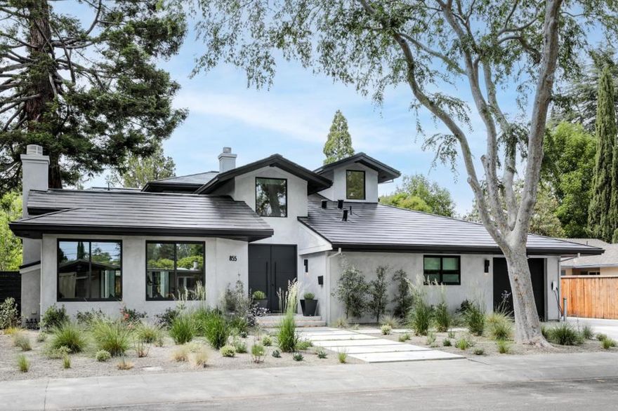 Exceptional whole-house transformation inside and out completed in 2020. Superb location on tree lined street, huge lot, Tesla solar roof tiles supplying whole house power, radiant heated floors, open concept design with soaring ceilings, automatic shades all operable from your iphone and more.Clean lined interiors, generous living room designed with 7.1 surround sound, informal dining room and breakfast room. Chef kitchen with top-of-the-line Thermador appliances, waterfall wrapped island, Calacatta marble-style quartz countertops, walk in pantry opening to the great room with retractable doors to the rear yard.Four main floor bedrooms serviced by 3 bathrooms and powder room, laundry room and floating staircase complete the main floor.Upstairs office, large primary bedroom suite with luxurious bath and walk-in closet. Huge oversized lot with sparkling pool, in-ground cover, synthetic lawn, landscape lighting, sonos, programmable lighting, excellent Palo Alto Schools close to Stanford.