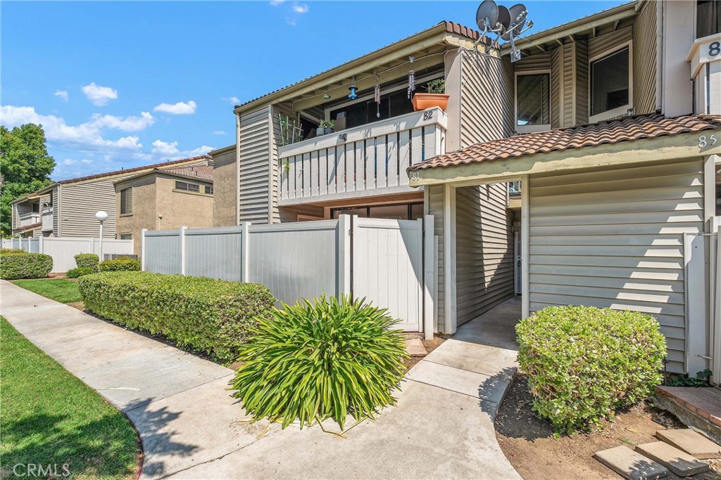 Charming Ground-Floor Condominium in Well-Maintained Phillips Meadows HOA. Welcome to this lovely, well-kept ground-floor condo located in the quiet and desirable Phillips Meadows community. Step into a bright and inviting living room featuring attractive laminate flooring and a large sliding glass door that opens to your own private patio — perfect for relaxing or entertaining. The remodeled kitchen is a true highlight, boasting newer cabinets, beautiful granite countertops, recessed lighting, a built-in china cabinet, and ample cabinet space. The adjacent dining area is conveniently located for both everyday meals and special gatherings. The spacious primary bedroom offers its own sliding glass door to the patio, a generous closet, and an en-suite private bathroom for added comfort and convenience. A large second bedroom features a sizable closet and direct access to the full hall bath, providing flexibility and privacy. Tile flooring runs throughout the home, offering both durability and easy maintenance. Additional perks include water and trash covered by the HOA, a serene location within the complex, and easy access to the 71 and 60 freeways, as well as nearby shopping and amenities. Don't miss this wonderful opportunity to own a beautifully maintained home in a great location!