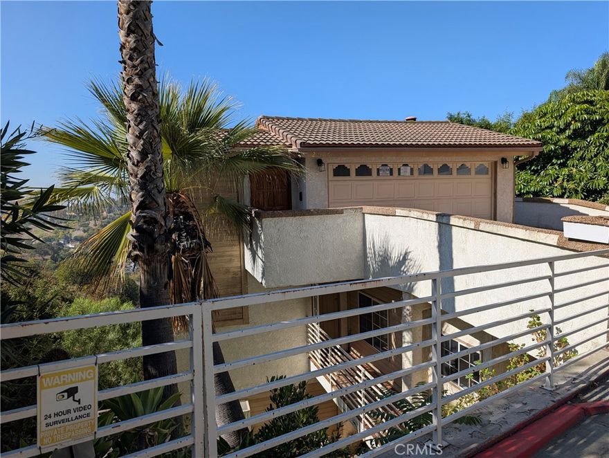 REO. This property has already gone back to the lender and must be sold. This is the lowest price-per-sqft for a home in South Pasadena by far! Large, bright and spacious view home in the hills of South Pasadena with panoramic DTLA, city lights, hillside, and even Palos Verdes Peninsula views from most rooms. This home has 6 bedrooms and 5.5 bathrooms with 4,075 sqft of living space (per old MLS). Four of the bedrooms have their own bathrooms, and the last two bedrooms are “jack and jill” with a shared bathroom between them. Although this home features brand new laminated wood plank flooring and carpet, and fresh interior paint in most areas, it is being sold in its “as-is” condition and is in need of some repairs and updating.  Features vaulted ceilings in the kitchen, family and living/dining rooms. Kitchen is open to the family room and features granite countertops, breakfast bar, wine cooler, and a separate wet bar. Huge utility room with laundry hook-ups, laundry sink, and a separate large bonus room. Lower floor features three bedrooms and two bathrooms and a large wood deck off the side of the house for additional entertaining space in addition to the view deck at the rear of the home. Down one more floor to two more en suite bedrooms, each with view decks. The bottom floor features a huge primary suite with large walk-in closet, and its own Carrara marble-lined Luxury bathroom, complete with huge walk-in shower and separate huge soaking tub, two vanities. Entrance is at the garage level and has a huge walk-in coat closet / storage room. Garage features many shelves and cabinets for storage, and a 220V outlet on the outside of the garage for charging your EV.