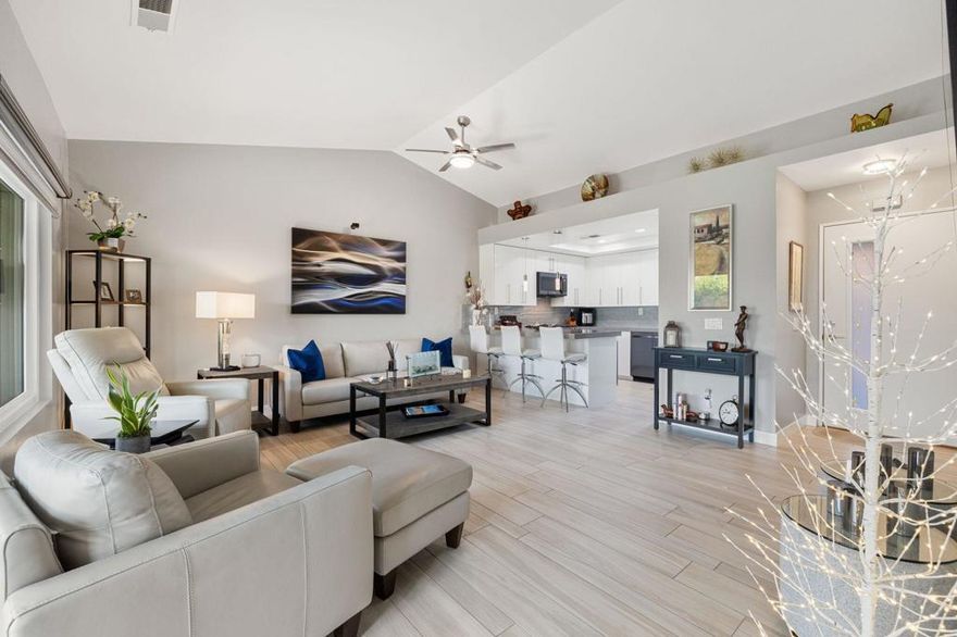 Charming, Fully Furnished & Extensively Remodeled Home in Oasis Country Club! Welcome to this beautifully updated and tastefully remodeled home located in the highly sought-after Oasis Country Club. Step through the tiled, gated courtyard into a thoughtfully renovated retreat designed for comfort and style. Inside, you'll find wood-look tile floors throughout and breathtaking southern mountain views from your cozy patio -- the perfect spot to relax. This home is packed with premium upgrades, including OWNED SOLAR, a newer AC unit with upgraded ductwork, and an additional AC system for the garage. The kitchen is a showstopper, featuring soft-close pull-outs, quartz countertops, designer tile backsplash, a gas range conversion, and newer appliances. Additional improvements include a newer water heater, upgraded electrical panel, high-efficiency dual-pane windows and slider, and so much more. The spacious bedroom offers a custom built-in closet, while the immaculate garage boasts epoxy floors and a dedicated EV charging outlet -- ideal for modern living. Oasis Country Club is a member-owned community offering endless amenities: tennis, pickleball, golf, a putting course, fitness center, library, dog park, and a remodeled clubhouse featuring a casual grill room for breakfast or lunch. The community's golf course is ranked among California's top executive courses -- making this the perfect place to live, play, and enjoy life. Don't miss your chance to own this move-in-ready, upgraded gem in one of the desert's most vibrant communities!