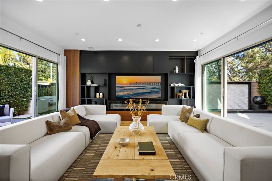 Absolutely breathtaking and reimagined with designer sophistication. This rare and highly upgraded floor plan spares no expense, blending Italian craftsmanship with modern luxury. Just recently redesigned by Studio Sean Design, the kitchen, living room, and primary closet have been thoughtfully curated to create an elevated, cohesive aesthetic featuring sleek new appliances, refined materials, and impeccable attention to detail.



Set on a premium corner cul-de-sac lot with hill views and an extended driveway for guest parking, this home offers both privacy and presence. Natural light floods the open-concept interior through stacking sliding doors that open to an intimate zen-inspired central courtyard, creating seamless indoor-outdoor flow and a warm, inviting atmosphere.



Every bedroom enjoys a private en-suite bathroom adorned with marble, quartz, and designer tile finishes. The chef’s kitchen is a true showpiece, boasting oversized Carrera quartz waterfall countertops, Sub-Zero and Wolf appliances, triple ovens, and a spacious butler’s pantry — perfect for effortless entertaining.



The luxurious primary suite includes a builder extension, spa-like bathroom with marble-style surrounds, custom wallpaper, and gold fixtures; along with a fully customized primary closet reimagined by Studio Sean Design for elevated functionality and design.

Outdoor living shines with custom hardscape, fountains, a built-in bar, and seating areas ideal for gatherings. Additional highlights include EV charging in the garage and fully paid-off solar panels.



Residents of this sought-after community enjoy resort-style amenities, including pools, spas, built-in BBQs, private parks, scenic trails, and proximity to the Great Park and Jeffrey Trails. Walking distance to top-rated Irvine schools — Stonegate Elementary, Sierra Vista Middle, and Northwood High — and just minutes from shopping, dining, and recreation.



51 Fenway is a rare opportunity to own a home that balances thoughtful design, comfort, and style — an exceptional blend of luxury and sophistication that sets a new standard for modern living.