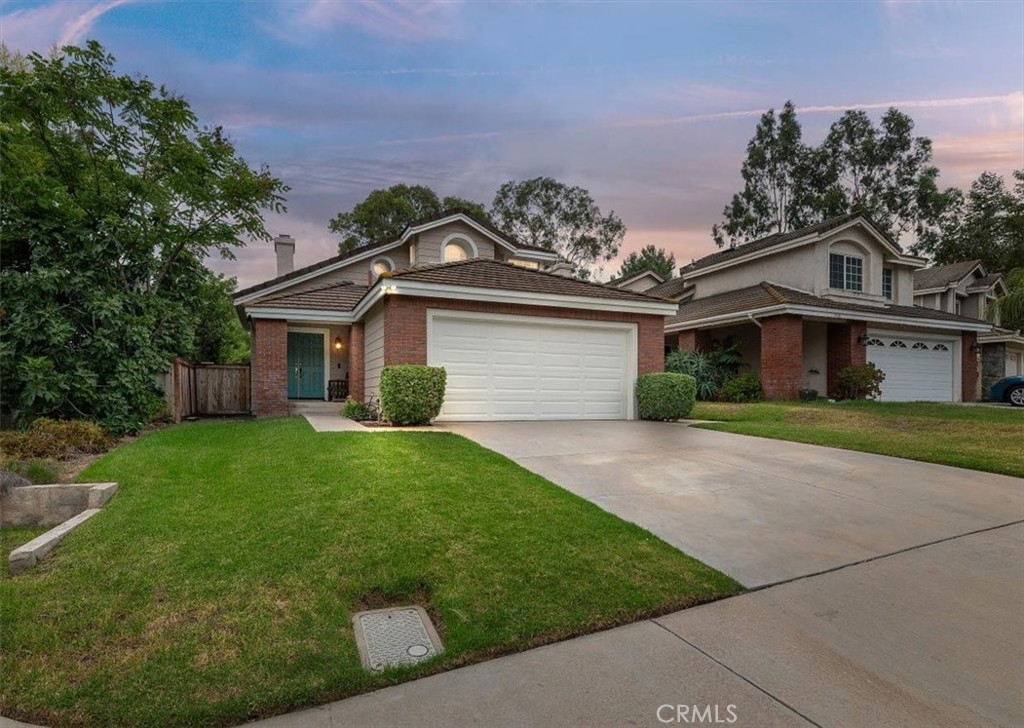 Welcome to this beautifully maintained home, offering comfort and versatility in the sought-after Lake Hill Community. Situated in a prime location, this home provides easy access to shopping centers, top-rated schools, hospitals, and the 91 freeway—making it an ideal choice for modern living. On the first floor, you'll discover a flexible bedroom perfect for a guest suite, office, or cozy den, complemented by a full bathroom for added convenience. As you head upstairs, you'll be greeted by the expansive master suite, a true sanctuary with a spacious walk-in closet, luxurious soaking tub, walk-in shower, and dual-sink vanity. The second bedroom serves as a private junior suite, complete with its own ensuite bathroom, walk-in closet, and generous living space. Step outside to a stunning backyard oasis featuring a covered patio, meticulously landscaped yards, and plenty of space for outdoor gatherings or quiet relaxation. With its well-designed layout, premium finishes, and unbeatable location, this home offers everything you need to live, work, and entertain in style. Don't miss this incredible opportunity—schedule your showing today!