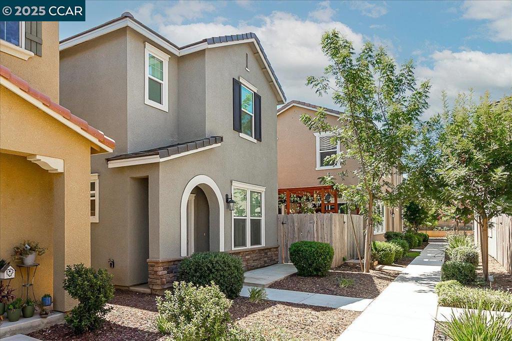 This inviting 3-bed, 2.5-bath contemporary home blends modern elegance with everyday comfort. Spread across two stories, it features luxury vinyl plank flooring downstairs and plush carpeting upstairs for a cozy yet refined feel. The open kitchen boasts granite countertops and stainless steel appliances—perfect for cooking and entertaining. The spacious living and dining room combo offers plenty of room to gather, while the downstairs laundry room adds convenience to your daily routine. Step outside to a large fenced backyard ideal for hosting, relaxing, or letting pets roam comfortably. An attached garage completes the package, making life here as seamless as it is stylish. Contemporary charm, practical space, and a backyard made for memories—this home has it all.