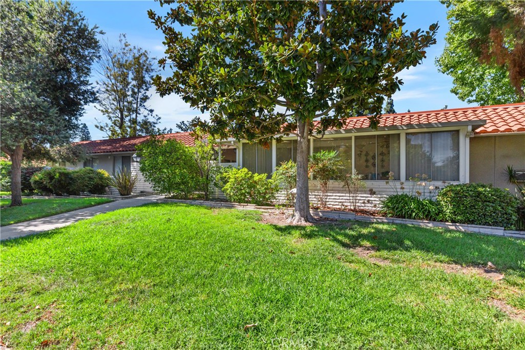 YOU WILL NOT WANT TO MISS SEEING THIS WONDERFUL "CASA LINDA" MODEL WITH NO STAIRS, NO ONE ABOVE, AND PARKING CLOSE BY. Has a GREAT CURB appeal! Welcome to easy living in this two-bedroom, two-bath home steps from the carport. An inviting great room opens to an expansive covered balcony where you can relax, dine, and enjoy a pleasant treetop outlook. The flowing floor plan offers a generous living and dining area with tile in the main spaces and soft carpet in the seating area for cozy comfort. The cheerful remodeled kitchen is light and functional with abundant cabinetry and a custom skylight that keeps everything bright. Both bedrooms are comfortably sized. The primary suite enjoys a convenient dressing vanity and access to the bath, while the guest bedroom is perfect for visitors, an office, or a hobby room. You will appreciate having your own interior laundry with a stacked washer and dryer, along with excellent storage throughout.
Peaceful setting, easy access, and close to parking make this a wonderful place to call home. You won't want to miss seeing it! Add all of this to the Laguna Woods Village lifestyle, and you have a winning combination. Enjoy a 27 hole championship golf course and a nine hole executive course, tennis, pickleball, paddle tennis, lawn bowling, two fitness centers, seven clubhouses, five swimming pools, an equestrian center, garden centers, an art studio, a world class woodshop, more than two hundred clubs and organizations, free bus service within the community and to nearby shopping, convenient RV parking, and you are approximately six miles from beautiful Laguna Beach. Country club living at its best. SEE 3D Tour and SLIDE SHOW. Carport 580 Space 3