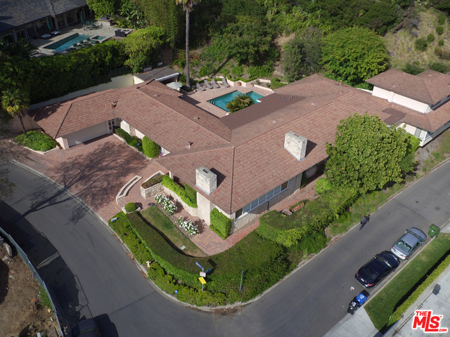 Graced by dozens of Hollywood legends, this celebrity owned time capsule, on the market for the first time in 50 years, has been kept in immaculate condition. Set on 21,000 SQFT of FLAT, DOUBLE lot with the opportunity to live in AS-IS, Add a second story, redevelop and/ or expand, this amazing property with stunning city views from downtown to the ocean is surrounded by some of the most impressive Hollywood Hills Developments. Close enough to the strip to feel its pulse, but far enough to be taken with a sense of community, neighborhood and walkability, this is truly one of the most special locations in Los Angeles. With 6BD 6BA, there are truly ENDLESS POSSIBILITIES for this incredible and unique trophy property filled with History, folklore and upside. ADD A SECOND STORY OR REDEVELOP COMPLETELY- THIS WILL NOT LAST.