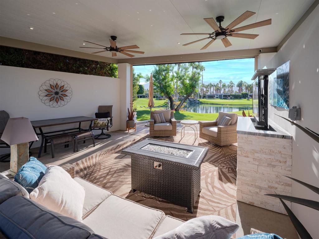Experience breathtaking views and ultimate relaxation at Lot 280 at Outdoor Resort Indio. Nestled with an incredible view of the mountains, golf course, and serene ponds, this turnkey luxury RV lot offers the perfect setting to unwind and entertain. Located just across the street from the pet area, it's a haven for pet lovers and outdoor enthusiasts alike.The lot features a solid roof pergola with electric sun shades, ensuring comfort in any weather, and an outdoor entertainment center complete with a pop-up TV. The medium-sized outdoor kitchen boasts two bars, a BBQ, fridge, dishwasher, storage drawers, and a rolling island, making it ideal for hosting gatherings or enjoying a quiet meal under the stars. Pavers and two privacy walls add to the sense of seclusion, while stylish furnishings and built-in lighting enhance the ambiance.This lot comes fully furnished (as-is) --ready for you to move in and start enjoying the Outdoor Resort Indio lifestyle. Whether watching the sunset over the mountains or relaxing by the pond, Lot 280 offers a rare combination of luxury, privacy, and stunning natural beauty. Don't miss the chance to make this exceptional property your own!‍Outdoor Resort Indio is a class-A motorcoach resort.