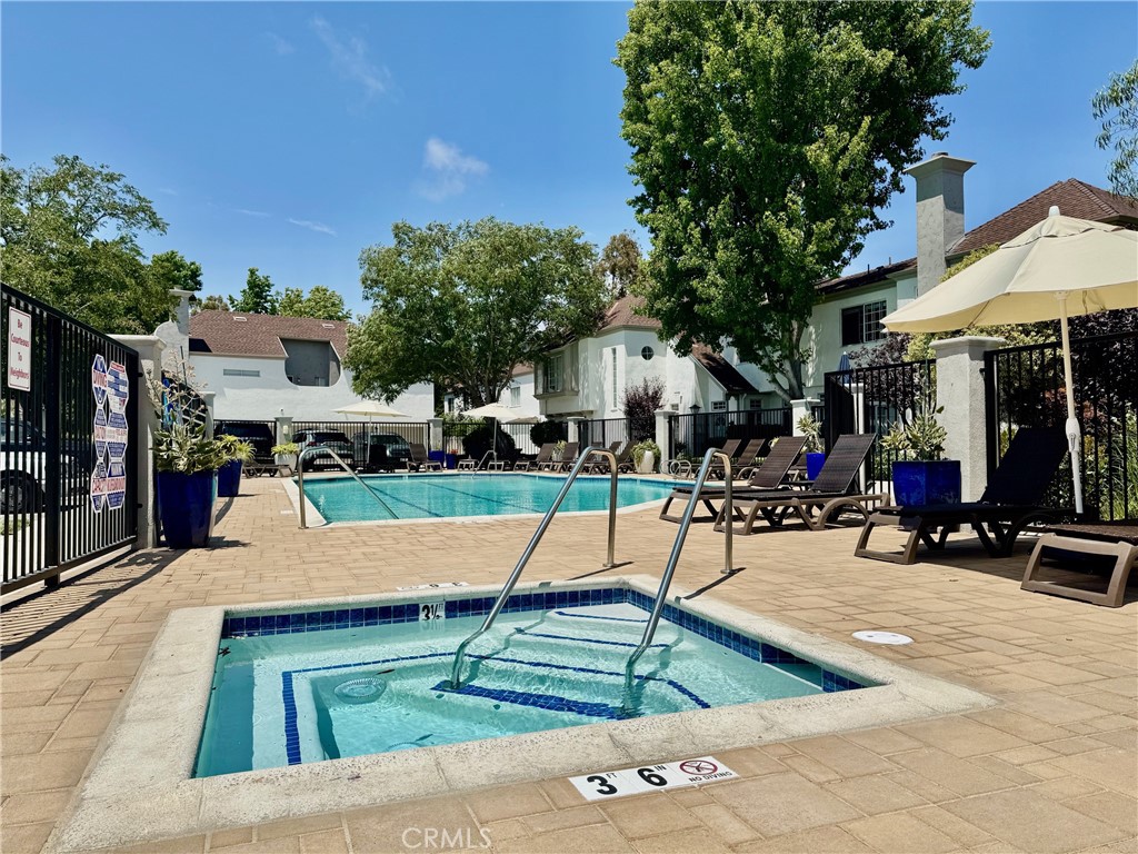 Welcome to 23653 Lexington Court in Laguna Niguel. This lovely 2-bedroom, 2.5 -bathroom condominium is located close to the coast in highly sought after Hampton Village. Enjoy the convenience of being minutes from beautiful beaches, major freeways, and nearby shopping centers for all your daily essentials. With approximately 1,041 square feet of thoughtfully designed space, this serene two-level town-home offers privacy with no neighbors above or below. The living, dining and entry have stylish well-maintained porcelain tile. The updated kitchen features recessed lighting, a walk-in pantry, separate bar counter with an abundance of cabinetry, newer appliances, quartz countertops, stylish subway tile backsplash, and direct access to the private patio. The sliding doors have been updated with tinted windows for additional privacy. The inviting living space has 2 large picture windows that flood the home with natural light. The main floor is complimented with a powder room with ceramic tile flooring for convenience and there is plenty of storage space in the under stair area. The second floor offers 2 PRIMARY EN-SUITES and has bamboo flooring. One of the primary bathrooms has dual sinks while the other offers a single sink and walk-in closet. The bathrooms have been updated with newer porcelain tile flooring. The washer and dryer are located upstairs and are included with the sale of the property. Additional upgrades include a newer A/C unit along with having the plumbing e-piped for added peace of mind. Beyond the home itself, the community is undergoing an exciting transformation with fresh exterior paint, updated landscaping, new garage doors, new asphalt and a beautifully redesigned pool area. Don’t miss this opportunity to own a stylish, move-in-ready condominium in an exceptional community.
Professional photos will be uploaded by July 27th. Unit currently has a dedicated handicapped space in front of the unit.