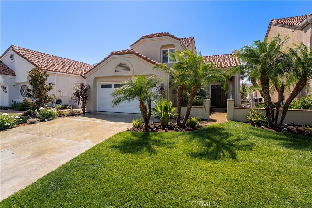 Welcome to 25628 Salerno Way, Yorba Linda – a beautifully updated 3-bedroom, 2.5-bath home offering approximately 1,523 sq. ft. of stylish living space. From the moment you enter through the charming, landscaped front courtyard, you’ll appreciate the attention to detail throughout.
The formal living room features a cozy fireplace with a custom mantle, plantation shutters, and sliding glass doors that open to the lushly landscaped backyard. Luxury vinyl plank flooring flows seamlessly throughout the home, complemented by solid-core doors with custom Craftsman-style framing.
The kitchen is equipped with stainless steel appliances, granite countertops, and LED recessed lighting, opening to the dining/family room for a bright, connected feel. The dining/family area offers crown molding, recessed lighting, and detailed window casings, creating an inviting space for gatherings. A remodeled half bath completes the main level.
Upstairs, all bedrooms feature luxury vinyl floors and plantation shutters. The oversized primary suite boasts a walk-in closet, while its bath has been tastefully updated with new cabinets, countertops, sinks, faucets, mirrors, lighting, and tile flooring. The hall bath is also refreshed with new flooring and counters. Secondary bedrooms offer mirrored wardrobes, custom closets, and recessed lighting—one enhanced with crown molding.
The backyard is a true entertainer’s paradise, professionally landscaped with pavers, a stylish Alumawood California room with ceiling fans, recessed lighting, and a mounted TV. The built-in BBQ island features bar seating, a refrigerator, and surrounding planters—all enclosed with newer vinyl fencing for privacy.
This home blends comfort, style, and outdoor living in one of Yorba Linda’s sought-after neighborhoods. Enjoy award winning Bryant Ranch Elementary School, Travis Ranch Middle and Yorba Linda High School!