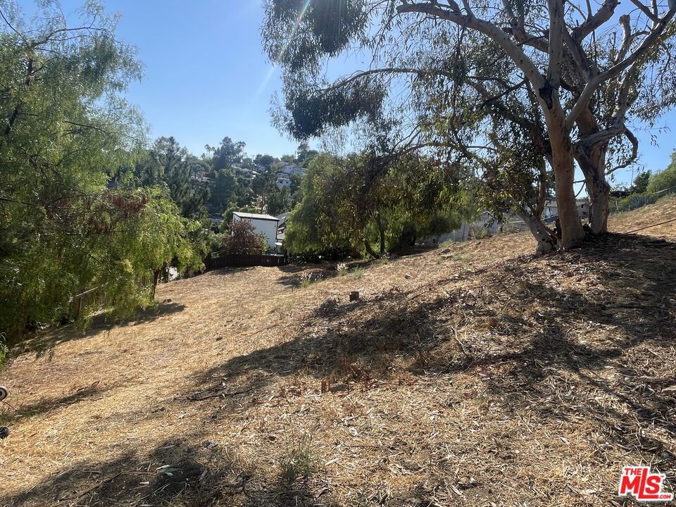 Prime Mount Washington building opportunity! Whether you are a developer, investor, or simply envisioning a custom hillside retreat, this combined offering includes a 6,340 sq ft buildable lot at 434 Cedar St and an adjacent 5,938 sq ft parcel at 442 Cedar St, totaling 12,278 sq ft. The property features excellent hillside and city views in a highly sought-after NELA location. Surrounded by vibrant neighborhoods such as Cypress Park, Highland Park, Glassell Park, and Eagle Rock, and just minutes from Downtown LA, it provides convenient access to the city while maintaining a peaceful hillside setting. Nature enthusiasts will appreciate nearby Heidelberg Park and Moon Canyon Park, while dining and shopping along York Blvd and Figueroa are only moments away. Please note: These lots are located on a "paper" section of Cedar St and will require the buyer to extend Cedar St approximately 100 feet to gain buildable access and secure necessary permits from the city. The boundary/topographic map for the two lots is available in the Doc(s) section. The seller is open to owner financing and flexible terms with at least 100K down.