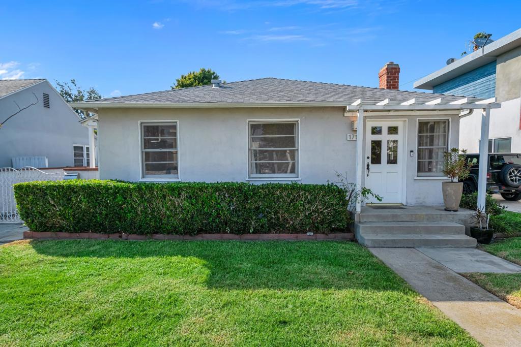 Tucked into a highly sought-after Santa Monica neighborhood, this home offers a rare blend of character, space, and opportunity—just minutes from the beach, shops, and parks. A welcoming front porch sets the tone, leading into a sun-drenched living room with vaulted ceilings, exposed beams, and a cozy fireplace that anchors the space. Hardwood floors flow through much of the home, complementing the open layout and natural light. The kitchen features whimsical tilework, stainless steel appliances, and ample cabinetry, offering both function and room for creative updates. A spacious family room with custom built-ins provides a flexible space perfect for working from home, relaxing, or play. The primary suite is a peaceful retreat with French doors opening to the backyard, a generous walk-in closet, and vaulted ceilings that add volume and light. Additional bedrooms are bright and well-sized, while the bathrooms retain charming, vintage tile details alongside dual vanities. Outside, the private yard—framed by mature hedges—offers space for entertaining, gardening, or future enhancements. A gated driveway ensures added privacy and convenience. Whether you're seeking a move-in ready home with soul or envisioning a custom renovation to make it your own, this property offers tremendous potential in a premier location. Enjoy close proximity to farmers’ markets, boutique shopping, acclaimed dining, bike paths, and sandy beaches. Opportunities like this—where character meets location and possibility—don’t come along often. Schedule your showing today!