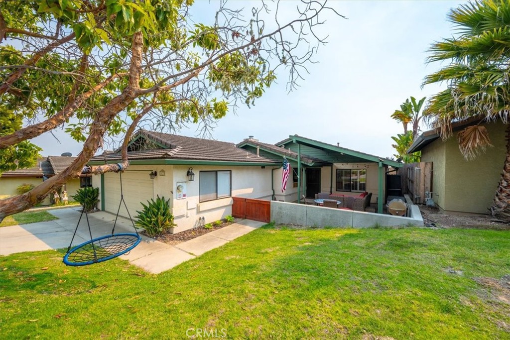 Charming Single-Level Home with Solar in Arroyo Grande.
This 3-bedroom, 2-bathroom home offers over 1,600 sq ft of comfortable living. The open kitchen with large pantry flows into a dining area and living room with a cozy fireplace. A bonus flex space provides options for a home office, playroom, or extra living area, and don't miss the perfectly placed hallway storage for all your essentials. The front covered patio is more than just a place to sit--it's your own little outdoor lounge. With a built-in drop screen, you can transform it into an open-air theater for unforgettable movie nights with family and friends. The low-maintenance side and backyard make outdoor living easy, and attached two-car garage adds everyday convenience. A tankless water heater and owned solar panels with battery backup system keep the home modern and energy-efficient--all combining style, comfort, and versatility in one inviting package.