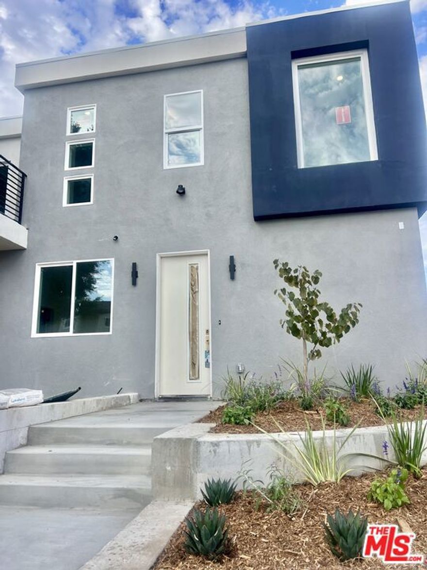 Be the first to live in this exceptional, brand-new construction townhome located in the heart of prime North Redondo Beach minutes from award winning schools, coveted beaches, shops, restaurants and entertainment. This multi-level contemporary residence perfectly blends cutting-edge design, comfort, and functionality for a truly elevated living experience. Step into a sunlit, open-concept floor plan featuring 3 spacious bedrooms and 3 full bathrooms, thoughtfully laid out for privacy and ease of living. The main level impresses with recessed lighting, soaring ceilings, captivating windows, and wide-plank laminate wood flooring throughout. The sleek, modern kitchen boasts quartz countertops, and stainless steel appliances ideal for both everyday living and effortless entertaining.The expansive living and dining areas open directly to a massive private patio, offering the perfect setting for outdoor lounging, al fresco dining, or weekend gatherings.Retreat to the bedrooms- 2 bedrooms are upstairs and one is downstairs. Each bathroom features modern finishes, high-quality fixtures, and clean, modern aesthetics. Additional highlights include a private 2-car garage with direct access, in-unit washer/dryer, central A/C and heat, and ample storage throughout the home. This is coastal living at its finest.
