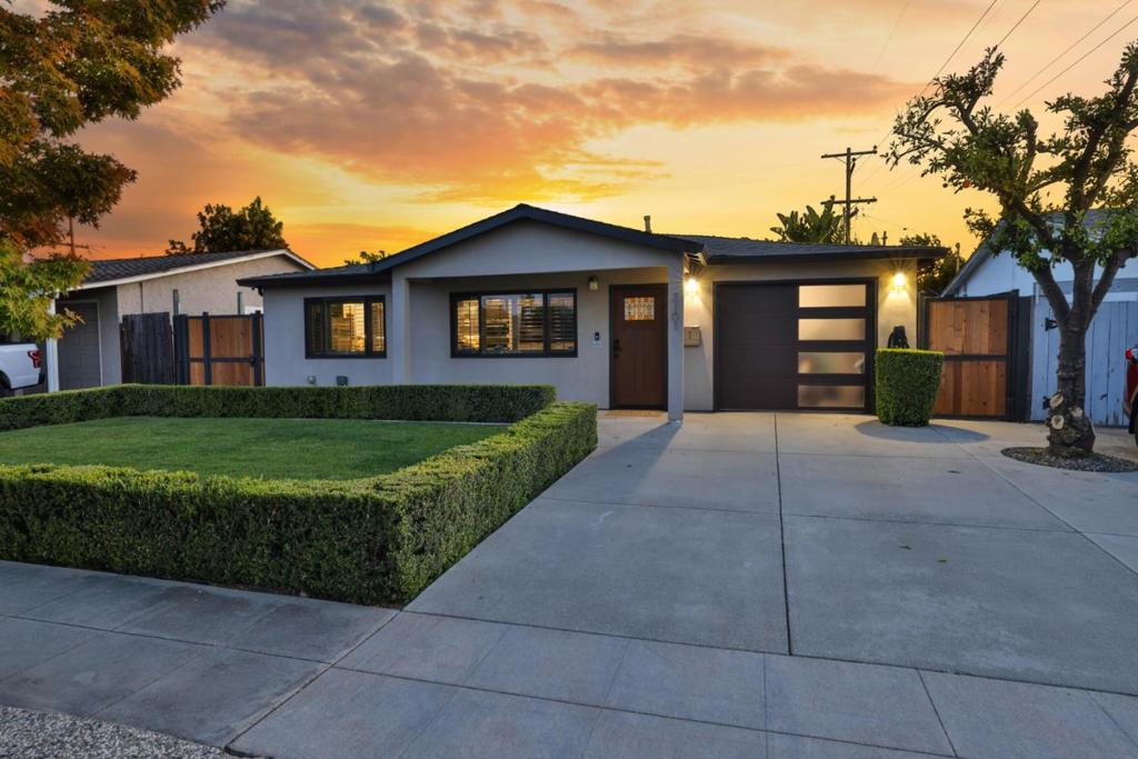 Cambrian schools! Extensively reconstructed in 2017, this modern home has tasteful design finishes, including a master bedroom/bath addition. The 4-bedroom, 2-bath home with a great room concept blends modern comfort with resort-style outdoor living. The master bedroom is spacious with two closets. Other bedrooms are small/compact. One bedroom is converted into an office with a sliding glass barn door. The backyard is a true private oasis, with mature giant bird of paradise trees providing privacy. It's an entertainer's dream with a solar-heated pool, a hot tub with LED lights, and a custom outdoor BBQ bar. The bar includes a built-in KitchenAid BBQ, gas cooker, and fridge under a pergola with retractable awnings. High-end Italian tile is used in baths. An oversized one-car garage with washer/dryer hookups completes this unique property. Additional features include integral-color stucco (no painting), tankless water heater, Tesla charger with Elon Musk signature, whole-house saltless water filtration, a large shed, an LED fireplace, dual flush toilets, and many smart home features. The property is also equipped with a professionally monitored alarm, video surveillance, custom Anderson tinted windows, custom side gates with double-sided # pads. Too many features to list them all!