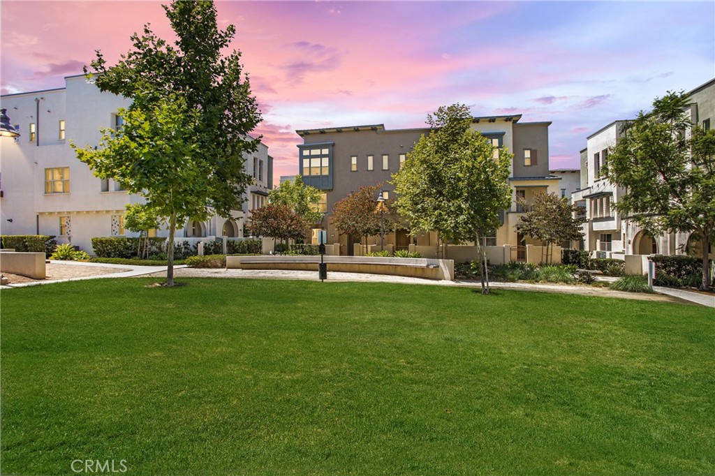 Welcome to this highly upgraded contemporary home in the heart of Irvine. MAIN LEVEL bedroom with a full bath. Located in Great Park neighborhood where you can enjoy endless amenities it has to offer. Gorgeous END UNIT 3 beds + 3.5 Baths brings plenty of sunlight and cozy feeling. Each generously sized bedroom features its own private en-suite bath. Newer luxury vinyl floors, LED recessed lights, and interior paint. No carpet with all hard surface floorings. Open layouts with large windows and high ceilings in every room. Unwind in the inviting open floor plan connecting kitchen, dining room, and living room. Beautifully appointed kitchen featuring quartz countertops, stainless steel appliances, walk-in pantry, white cabinetry, with an oversized island that opens to the dining and living room. Upstairs leads to spacious master suite complete with soaring high ceiling, LED recessed lights, and walk in closet. Master bath has dual vanities, white cabinetry, and a spacious walk-in shower. This home features newly installed RO water system, water softener that's better for your skin overall, EV charger outlet in the garage with extra storage area. The first floor has a two-bay garage, a bright bedroom with walk-in closet and its own bathroom. Direct access to the attached 2-car garage. Located within walking distance to Beacon Park School (K-8), trails, parks, clubhouse, and community pools. The front door is facing a green belt with seatings and plenty of outdoor space for your family to enjoy. Acamar is located near the Woodbury Town Center, The OC Great Park, Five Point ice Arena, Irvine Spectrum, UCI and many great restaurants. 20 mins local to Laguna Beach and Fashion Island. See it soon and make it your home! Availability Date: Immediately.