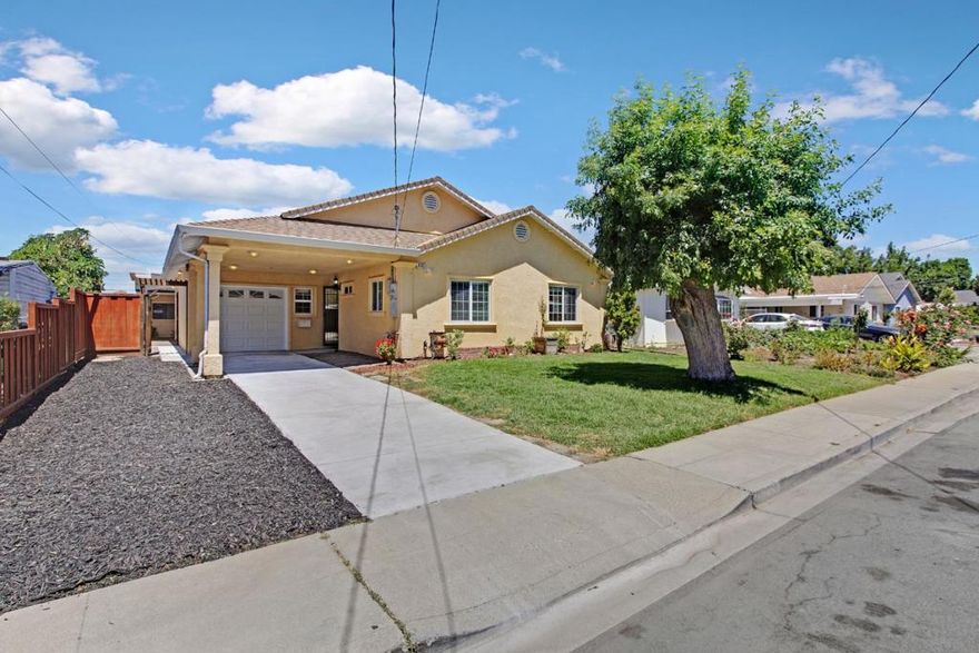 Welcome to this beautifully updated 4-bedroom, 3-bathroom home in the heart of Fremont, offering the perfect blend of comfort, style, and functionality.  Step inside to soaring vaulted ceilings that create a bright, airy atmosphere, complemented by new luxury vinyl plank flooring throughout. Freshly painted interiors enhance the clean, modern feel, while natural light pours in through skylights and dual-pane windows, creating an inviting ambiance in every room.  The thoughtfully designed layout includes a formal dining room and a cozy family room, ideal for gatherings or quiet evenings at home. The updated bathrooms feature sleek, modern finishes that add to the homes fresh, contemporary vibe. Slide open the glass doors to your private backyard oasis, complete with a flagstone patio, built-in brick barbecue, standalone storage shed, and a variety of fruit trees. The professionally landscaped front and back yards offer beautiful, low-maintenance outdoor spaces, including drought-tolerant landscaping in the front yard. Whether you're entertaining guests or enjoying a peaceful night in, this home truly has it all. Move-in ready and waiting for you to make it your own. OPEN HOUSE 9/28/2025