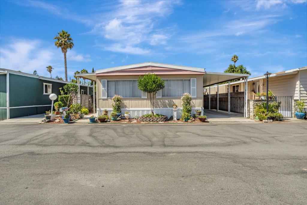Welcome to this beautifully maintained 2-bedroom, 2-bathroom home in the heart of San Jose. With a very low space rent and offering 1,444 sq. ft. of thoughtfully designed living space, this residence perfectly balances comfort, convenience, and style. The spacious kitchen is equipped with a gas cooktop, built-in oven, dishwasher, and vent hood, ideal for everyday cooking or entertaining. A bright kitchen/family room combo creates a welcoming gathering area, while the formal dining space is perfect for hosting. This home showcases newer laminate flooring throughout, adding both durability and contemporary appeal. A well-maintained roof provides long-term peace of mind. Additional highlights include a full laundry area with washer and dryer (included) and central heating and A/C. Located within a great school district and offering easy access to major highways, shopping centers, restaurants, and entertainment, this home is as convenient as it is comfortable. Combining functionality with charm, it presents a fantastic opportunity to enjoy the best of San Jose living in a prime location.