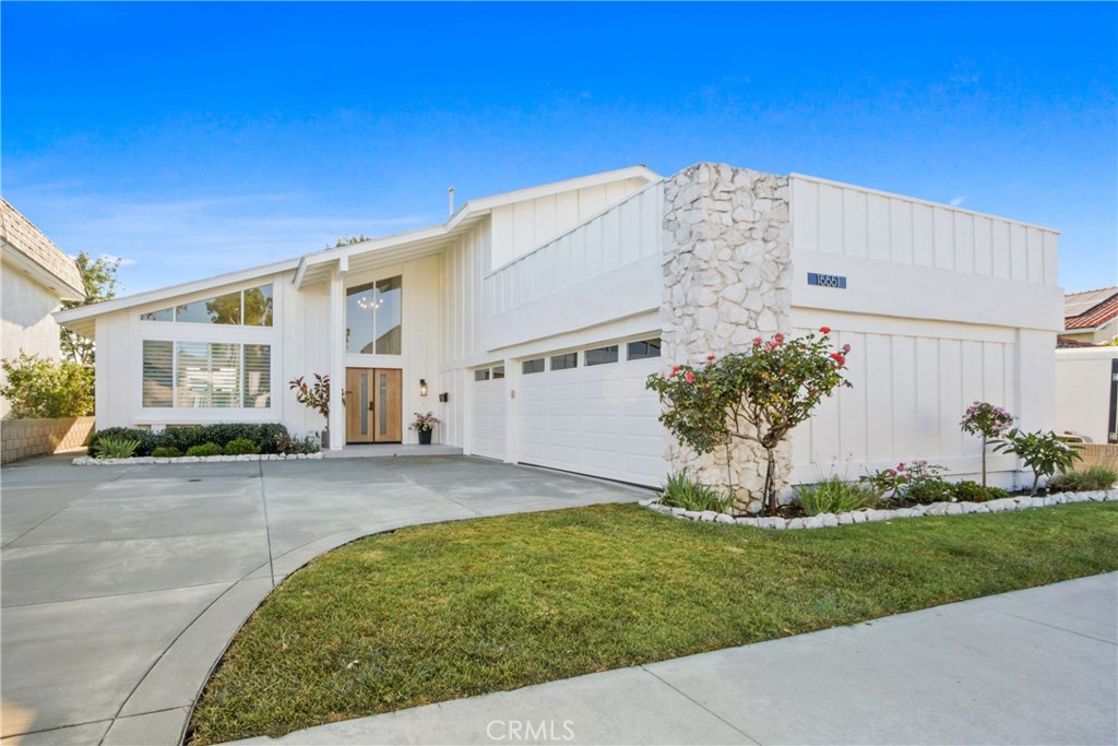 Amazing Opportunity! Beautifully remodeled S&S home on a 6,000 sqft cul de sac lot in the highly acclaimed community of Goldenwest Park! This stunning 4 bed/3 bath home has been completely remodeled with the highest level of quality and meticulous details throughout. Thoughtfully designed, this home is highlighted by an abundance of natural light with all of the living spaces harmoniously connected under the vaulted ceilings, including an elegant living room, large dining room, and an all new chef’s kitchen with professional grade appliances. The step down family room is a welcoming space with a wall of windows overlooking the backyard and offers a custom fireplace. The ideal downstairs bedroom and ¾ bath is just off the family room and leads to the oversized 3-car garage. Upstairs you will find a luxurious master suite with vaulted ceilings, walk-in closet and an amazing en-suite bathroom; extensive use of designer tiles, quartz, and a dual sink vanity. Step outside to a well-manicured backyard with a low-maintenance patio cover and block wall fencing, ideal for outdoor relaxation. This gorgeous home backs to a lake park which provides stunning sunset views and a serene retreat like atmosphere. Additional features include a brand new 200 amp electrical panel, water heater and HVAC system. Minutes to Huntington Beach’s finest amenities, including the Bella Terra shopping center, restaurants, Costco, Old World, the 405 freeway, award-winning schools, and some of California’s best beaches.