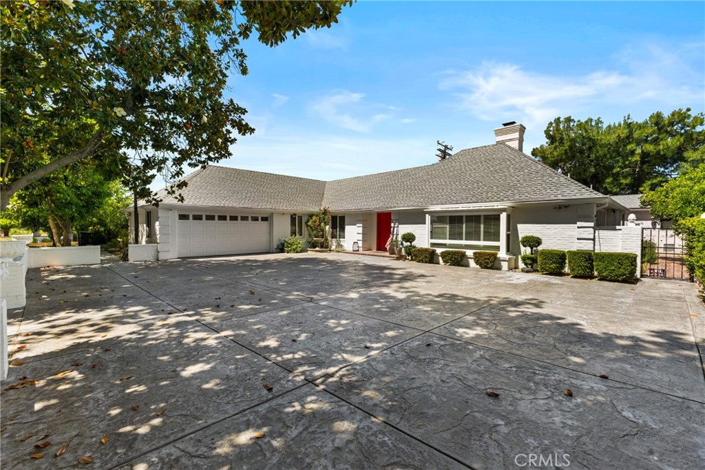 3 Beds | 3.5 Baths | Pool | 2,783 Sq Ft | 2-Car Garage | Solar-Powered
Welcome to 3120 Parkside Dr. — a beautifully updated 1950 home that blends timeless character with modern comforts. Boasting 2,783 sq ft of living space on a generous 15,150 sq ft lot, this 3-bedroom, 3.5-bathroom residence sits directly across from the Arrowhead Country Club, offering stunning golf course and mountain views.
Step through the eye-catching red front door into a bright, welcoming living room with a cozy fireplace and natural light streaming through large windows. Just off the main living area, the formal dining room glows with backyard views, while the kitchen shines with elongated windows that highlight the home’s lush outdoor space.
The primary suite is a luxurious retreat featuring a bedroom fireplace, lounge area, walk-in shower, jetted tub, double sink bathroom vanity, dedicated vanity station, and private water closet. One of the bedrooms serves perfectly as a home office or guest suite, featuring its own bathroom, charming bay windows, and direct access to a serene courtyard.
The beautifully remodeled guest bathroom includes a double sink vanity, walk-in shower, and soaking tub. A full laundry room connects to the garage and opens to the pool area for added convenience.
Outside, the expansive backyard is designed for both relaxation and entertainment, featuring a covered patio and a gated pool and spa that offer privacy and safety. Energy efficiency is a bonus with paid-off solar panels, and a security system with cameras adds peace of mind.
Additional highlights include a spacious 2-car garage, an oversized driveway with standout curb appeal, and tasteful updates throughout—all while retaining the charm of its 1950s design.