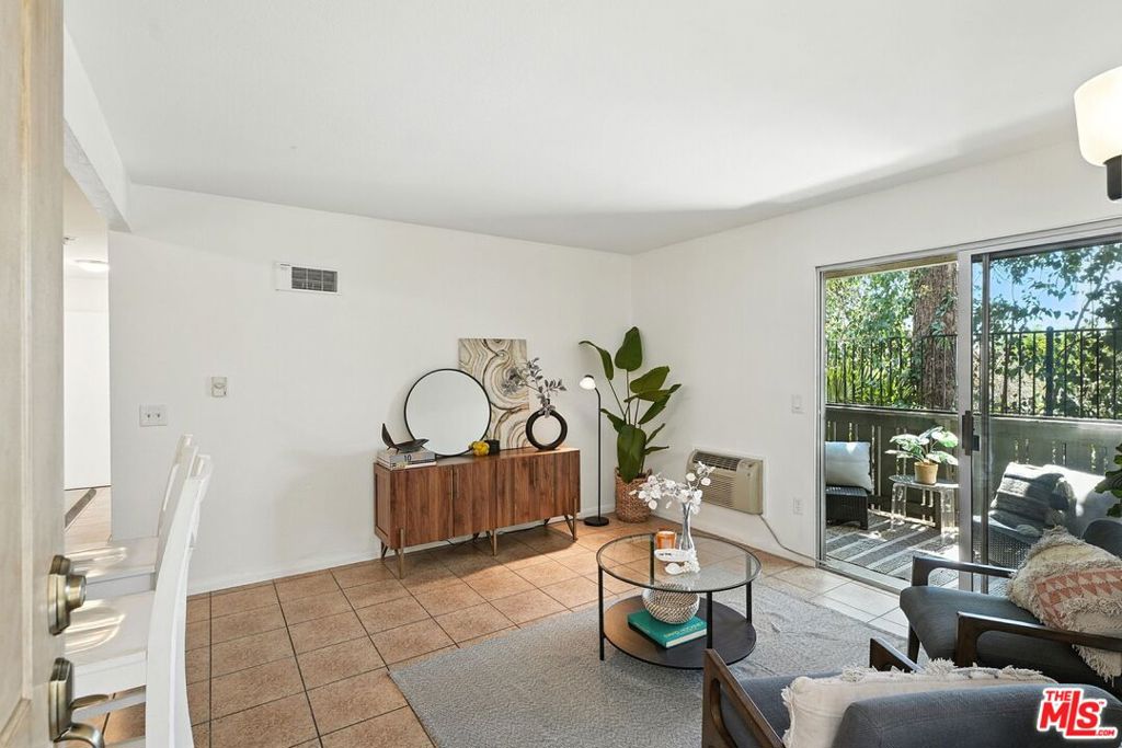 Sweet Escondido living! Step into this refreshed first-floor corner unit in the peaceful, gated Village Green community. With updated finishes and fresh paint throughout, this charming two-bedroom, one-bathroom condominium is ready for you to unpack and start enjoying your SoCal life. You'll love the bright, airy feel of this corner location, where both bedrooms enjoy plenty of natural light and comfortable living space. The primary bedroom offers a peaceful retreat, while the second bedroom works perfectly as a guest room, home office, or creative space. The full bathroom has been thoughtfully updated with modern fixtures and finishes, perfect for your daily routine. The large closet area in your primary suite features an additional mirrored vanity and sink for getting ready. Enjoy dinner in the dining area, at your breakfast bar, or on your private patio. The patio is spacious enough for comfortable seating, and laundry day becomes a breeze with your full-size washer and dryer conveniently located in a closet off the patio. The secluded setting gives you privacy while still connecting you to the beautiful Village Green community around you. Included is one covered carport parking spot, plus additional guest spaces for friends and family visits. Living in Village Green means having wonderful amenities right at your doorstep. Meet your neighbors at the community pool, tennis courts, playground, and dog park area. The location couldn't be more convenient. You're just minutes from downtown Escondido's great restaurants and shops, with easy access to both the 78 and 15 freeways for wherever life takes you. Quality schools are nearby, and San Marcos State University is just 10 minutes away. When you're ready for some beach time, you're only about 30 minutes from the coast. This is an especially great opportunity if you're buying your first home. Come see how comfortable and convenient life can be in this wonderful Village Green home. HOA fee includes water & trash. The Complex is NOT FHA approved, but is VA approved.