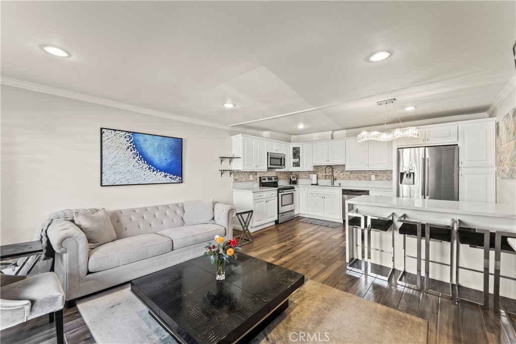 Welcome to this beautifully remodeled one-bedroom, one-bath condo in the heart of Sherman Oaks. Thoughtfully designed and move-in ready, this home offers comfort, convenience, and modern style. The light-filled interior features fresh paint, a modern kitchen with updated appliances, and an in-unit washer and dryer for effortless living. A private balcony provides a peaceful space to unwind, while the included TV adds a touch of ease and entertainment. Residents will appreciate the quiet, residential neighborhood, one dedicated garage parking space, and ample street parking for guests. Community amenities include a sparkling pool and beautifully maintained grounds, creating a serene setting just minutes from Ventura Boulevard’s popular shops, restaurants, and cafés.