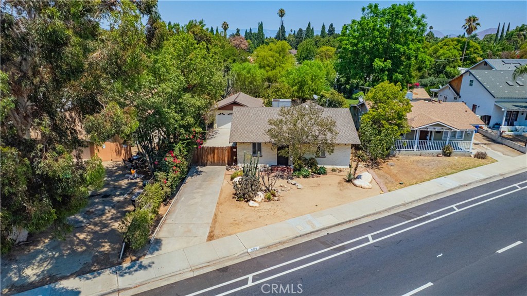 Single Story Riverside Home offering 3 bedrooms, 2 bathrooms, and 1,332 sqft of comfortable living space close to the Wood Streets. Offering a newer roof (2016), new water heater, dual-pane windows. The inviting interior features a bright living area with beautiful wood plank ceiling, cozy brick interior, updated guest bathroom with tile flooring & shower with convenient indoor laundry room. The kitchen offers updated counters and cabinet space and its own dining room with pantry space. Situated on a large lot, this property offers two storage sheds, gated RV/Boat or additional parking on the side yard and a detached 2 car garage. The expansive backyard is perfect for entertaining, gardening, or relaxing in your own private retreat. Enjoy the convenience of being close to Riverside City College, local schools, Downtown Riverside, shopping, dining, and the 91 freeway for an easy commute. No HOA and low taxes.