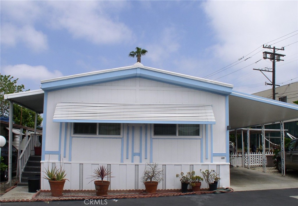 A MUST SEE: Charming doublewide mobile home in Garden West Estates, a vibrant senior community. This well-maintained 2-bedroom, 1¾-bath home boasts a spacious lot with a lovely patio and a large storage shed. The house is in excellent condition, with double-pane windows, two A/C window units for comfort, an in-home laundry, and is being freshly painted in the living areas. Great location near the clubhouse, pool, and car wash area. Includes washer, dryer, microwave, and a large refrigerator with a pull-out freezer. The community has two clubhouses, two pools, a gym off the front pool, and a dog walk area. Walking distance to shopping and restaurants, perfect for convenient, low-maintenance living! Don't Miss It!