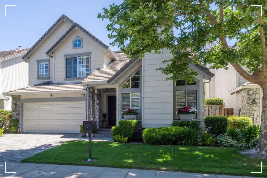 Beautifully remodeled in Hampton Oaks, this home offers stylish living with designer finishes and an extra-large rear yard with gorgeous gardens and lots of space for outdoor living. Light oak floors on main level, carpet upstairs, and custom shutters on most windows. A dramatic vaulted ceiling enhances the living and dining room combination with fireplace and a butlers pantry leads to the all-white designer kitchen with marble-style quartz counters, peninsula counter seating, and built-in desk. The open family room includes a custom bar, gas-log fireplace with imported mantel, and sliding glass door to the private yard. Spacious loft is prefect for an office and offers potential for a fourth bedroom. The primary suite features an electric fireplace, customized walk-in closet, and lovely bath. Two additional bedrooms are served by a hallway bath. Other highlights include a laundry room, Tesla charger outlet in the attached 2-car garage, a full backup generator, 2-zone A/C, surround sound in living and family rooms, and security system with alarm and cameras. The community has a large park with pool, playground, and more. HOA includes front landscaping. A rare turn-key opportunity in an ideal location.