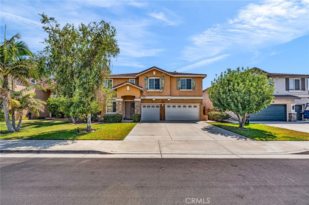Experience exceptional living at in Eastvale—a beautifully crafted oak-style home offered for the first time. This spacious four-bedroom residence features a thoughtfully designed layout perfect for both entertaining and daily comfort. Elegant Master Suite:Retreat to an expansive master bedroom with a cozy fireplace, two walk-in closets, and a luxurious master bath complete with a jet soaking tub. Versatile Living Spaces: Enjoy an upstairs family room ideal for relaxation or gatherings, plus a dedicated nook perfect for a home office or study area. Gourmet Kitchen: The heart of the home boasts an inviting island, a walk-in pantry, and seamless flow to the family room—ideal for hosting and everyday living. Downstairs Guest Suite: A convenient downstairs bedroom with a full bathroom and walk-in shower accommodates guests or multi-generational living. Inviting Living Room: Gather around the living room fireplace in a space designed for comfort and connection. Outdoor Oasis:Step into a beautifully landscaped backyard featuring a sparkling pool with a tranquil waterfall, perfect for barbecues and outdoor entertaining. Ample space allows for patio and pool furniture, creating your own private retreat. Welcoming Entry: A formal entryway sets the tone for this impressive home, while rich wood finishes throughout add warmth and character. Thoughtful Layout: The master suite is privately situated opposite the secondary bedrooms for enhanced tranquility. This rare opportunity combines luxury, functionality, and a stunning outdoor setting—ready to welcome you home and elevate your lifestyle. Discover the best of Eastvale living.