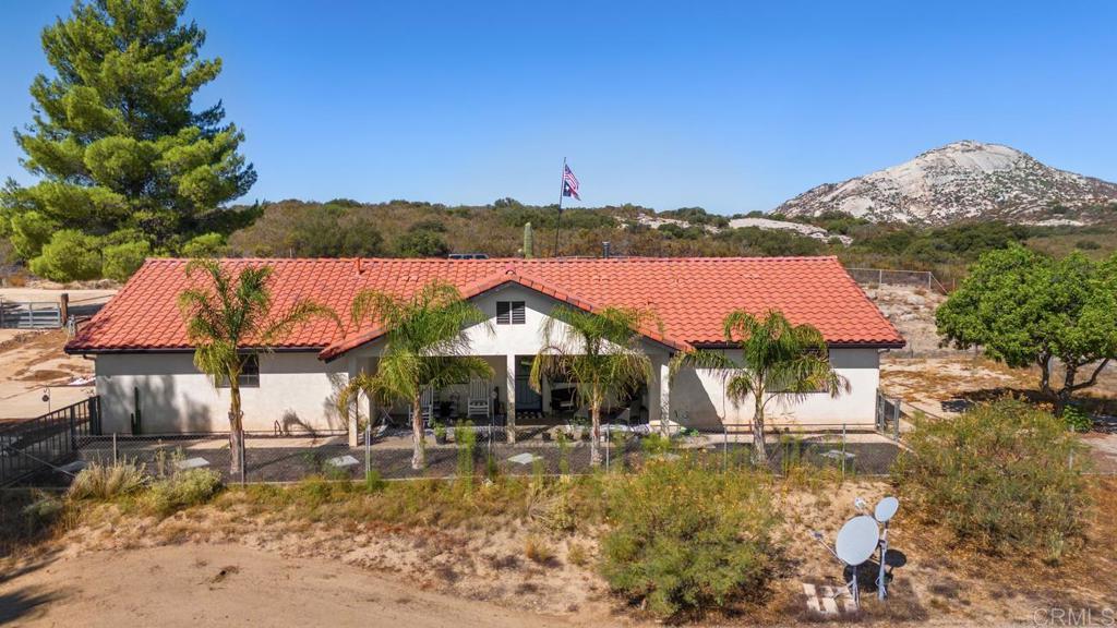 Escape to the serenity of country living with this spacious and versatile 8-acre property in the peaceful community of Campo. Offering a blend of privacy, usability, and charm, this mostly flat parcel is ideal for those seeking room to spread out, enjoy nature, or create their dream homestead. The land provides ample space for animals, gardening, or outdoor recreation, and is enhanced by fruit trees and expansive views that frame a truly tranquil setting. The property offers endless possibilities with plenty of room to add an ADU or Jr. ADU, perfect for multigenerational living, guest accommodations, or rental opportunities. According to tax records, the home is a 3-bedroom, 2-bathroom, currently configured as a comfortable 2-bedroom, 2-bathroom layout, giving you flexibility to adapt the space to your lifestyle. A covered patio extends your living space outdoors, providing a quiet spot to enjoy your morning coffee while taking in the peaceful surroundings. Practical features make this property even more appealing, including a 10-gallon water tank, full fencing with added snake fencing, and RV hook-ups for visitors or extended stays. Whether you’re looking to raise animals, build additional structures, or simply enjoy the wide-open land, this property has the space and infrastructure to support your vision. Tucked away in a quiet, secluded location yet still conveniently close to schools and freeway access, this unique property offers the best of both worlds: the calm of rural living with easy access to modern amenities. Bring your ideas, your animals, and your dreams — this is the perfect canvas for your country lifestyle. A new roof was put on in the beginning of 2021, new flooring installed throughout in 2021, and a new well was dug at the end of 2020.