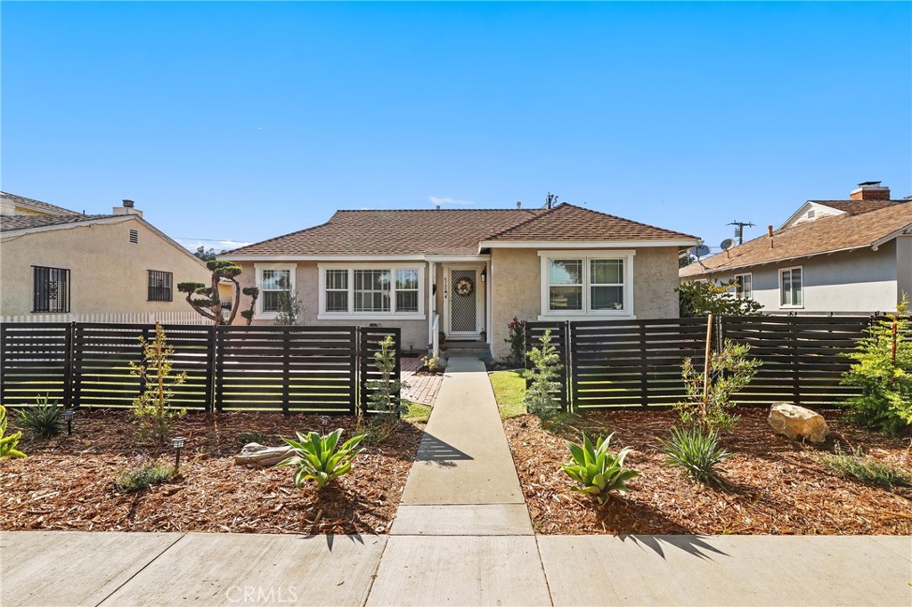 Welcome to this truly cherished Whittier home, lovingly owned by the same family for 60 wonderful years. Gleaming original hardwood floors flow through much of the interior, inviting you into three generously sized bedrooms, including a comfortable en-suite for added convenience. The heart of the home features a spacious kitchen that seamlessly connects to a large, inviting living room, perfect for gathering. Step outside to discover your own park-like backyard oasis, complete with a delightful patio and a detached garage offering exciting potential for an ADU. This well-loved residence radiates warmth and is now ready for its next chapter, eager to help you create lasting memories.