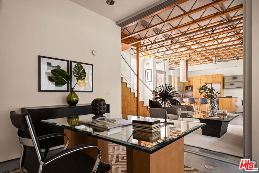 Live just steps from Abbot Kinney, this sleek, loft-style townhome is tucked away on a quiet, tree-lined street in the heart of Venice. With two spacious outdoor decks offering panoramic city views and unforgettable sunsets, this is the ultimate space to relax, entertain, or unwind above it all. Inside, a gated, lush courtyard leads to an open and airy living space featuring dramatic vaulted ceilings and an abundance of natural light. The chef's kitchen is outfitted with stainless steel appliances, generous counter space, and contemporary finishes that flow seamlessly into the dining area, living room, and a cozy den or office. Upstairs, the primary suite is a peaceful retreat, joined by two additional light-filled bedrooms. A wrap-around balcony and rooftop terrace offer a rare connection to the outdoors in a coveted urban setting. The home includes two covered parking spaces within a gated area, providing convenience and peace of mind. Just moments from Venice's best restaurants, boutiques, and cafes, this home effortlessly blends style, comfort, and an unbeatable location. Experience refined coastal living in one of LA's most vibrant neighborhoods.