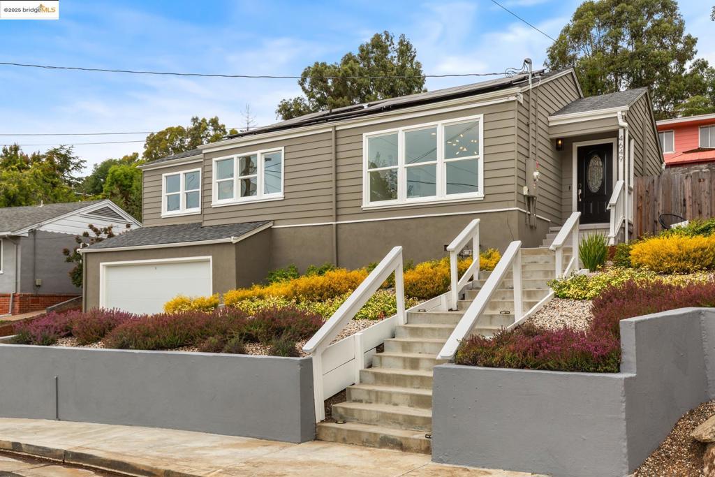 Experience open-concept living in this beautifully renovated 3-bedroom, 2-bath home, ideally located in Oakland’s desirable Leona Heights neighborhood. Fully updated in 2019, the home offers a spacious, thoughtfully designed layout where the living room, dining area, kitchen, and a den/bonus space flow seamlessly together—perfect for everyday living and effortless entertaining. Enjoy true California indoor/outdoor living with direct access from the kitchen and dining area to a generous backyard featuring a large deck and garden. The updated kitchen includes granite countertops, an island with seating, and plenty of storage. The smart “L”-shaped floor plan places all bedrooms in a private wing of the home. The primary suite features dual mirrored closets, a full ensuite bathroom, and direct access to the backyard. Two additional sun-filled bedrooms offer flexible space for guests, family, or a home office. Modern upgrades include central air conditioning, a Tesla Powerwall, solar panels, and an on-demand water heater. The spacious two-car garage also features a separate storage area for added convenience. Ideally located just minutes from hiking trails, parks, Montclair and Laurel Village shops and restaurants, and with easy access to Highways 580 and 13.