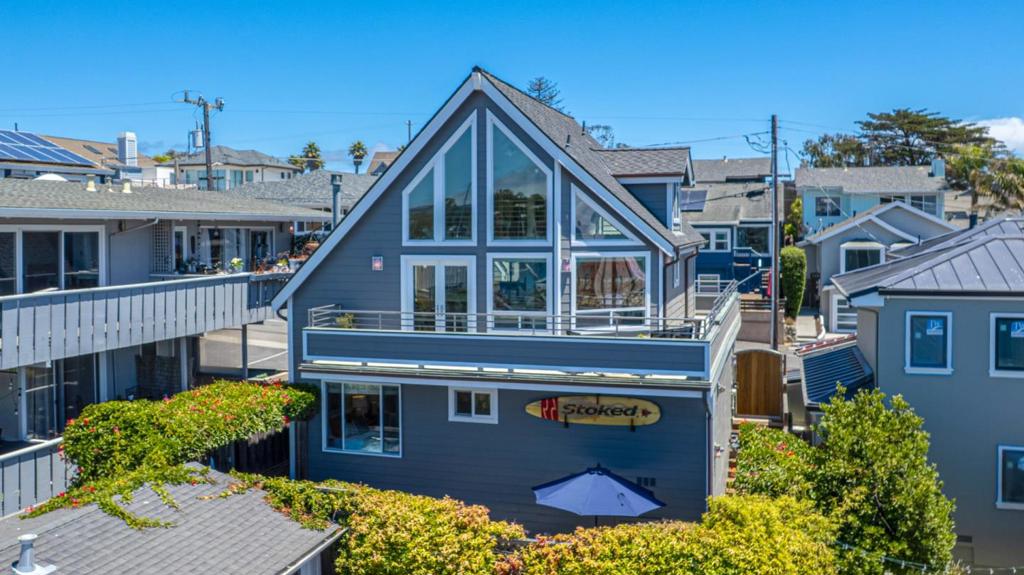 200 ft. to Twin Lakes Beach. Striking views over Monterey Bay, the beach, the Yacht Harbor and both Lighthouses while looking past the wharf to Steamer Lane. This is a beautifully remodeled and maintained beach home which has a garage, off-street parking, and a fully fenced and hardscaped backyard. The spa is ready. The home is the second from the beach on 6th Ave. It is one block from the east Yacht Harbor Entrance, which gives access to the Crow's Nest, Palomar, and Java Junction. Upstairs in the home is a chef's kitchen which adjoins the spacious living room. The living room has a two-story high wall of windows that are the gateway to the ocean and harbor views. It is incredible. There is a loft which many want to call their own. It is exceptionally comfortable and has south-facing ocean views from a dormer window. The wrap-around deck, with all the views, enhances entertainment. This is a fabulous property and home. Turnkey and ready!