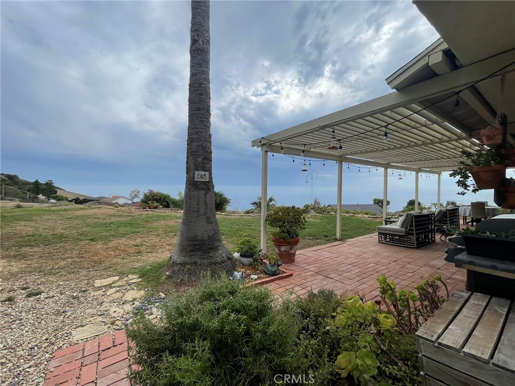 Welcome to your personal slice of paradise! Enjoy breathtaking ocean and Catalina Island views from this charming two-story Mediterranean-style home located in the desirable coastal neighborhood of Mira Catalina, this spacious residence offers a rare opportunity to live in a classic hillside retreat with stunning sunset panoramas and cool ocean breezes. The 3-bedroom, 3-bath beauty features a traditional layout with generous living space, large windows, and an spacious kitchen with plenty of storage which opens into the family room. Incredible views from every bedroom, especially the large primary ensuite with an inviting fireplace and gorgeous French door for privacy. The separate laundry area inside, plus the two car garage with direct access to the house, make it very practical for your daily routines. This cozy home in its original character, is clean, functional, and full of potential for someone seeking space, privacy, and a spectacular setting. This delightful home is nestled on a huge lot adorned with varieties of fruit trees — perfect for seasonal harvests and homemade treats. Whether you're sipping morning coffee under the shade of a blossoming tree or enjoying backyard barbecues surrounded by nature the expansive fenced-in lot is great for kids to play, to entertain family and friends, and for dogs to run around. Conveniently located close to schools, hiking trails, Trump Golf Course, Terranea Resort, shopping, 110 FWY and Terminal Island.