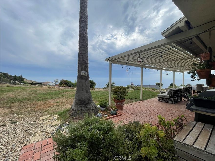 Welcome to your personal slice of paradise! Enjoy breathtaking ocean and Catalina Island views from this charming two-story Mediterranean-style home located in the desirable coastal neighborhood of Mira Catalina, this spacious residence offers a rare opportunity to live in a classic hillside retreat with stunning sunset panoramas and cool ocean breezes. The 3-bedroom, 3-bath beauty features a traditional layout with generous living space, large windows, and an spacious kitchen with plenty of storage which opens into the family room. Incredible views from every bedroom, especially the large primary ensuite with an inviting fireplace and gorgeous French door for privacy. The separate laundry area inside, plus the two car garage with direct access to the house, make it very practical for your daily routines. This cozy home in its original character, is clean, functional, and full of potential for someone seeking space, privacy, and a spectacular setting. This delightful home is nestled on a huge lot adorned with varieties of fruit trees — perfect for seasonal harvests and homemade treats. Whether you're sipping morning coffee under the shade of a blossoming tree or enjoying backyard barbecues surrounded by nature the expansive fenced-in lot is great for kids to play, to entertain family and friends, and for dogs to run around. Conveniently located close to schools, hiking trails, Trump Golf Course, Terranea Resort, shopping, 110 FWY and Terminal Island.