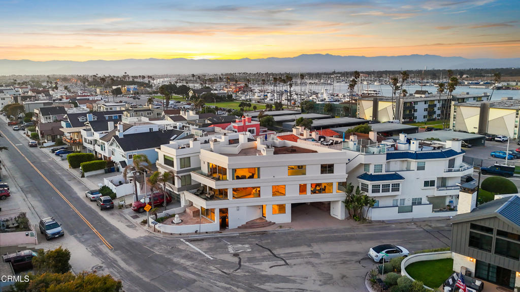 Live the Dream on Hollywood Beach with Views & Elevator! 360 degree views of Ocean, Islands, Harbor, Mountains & Built by Walt Phillips!Welcome to your private slice of paradise on Hollywood Beach, where ocean breezes, golden sunsets, & breathtaking island views set the tone for laid-back luxury. Delivered fully furnished, this rare coastal retreat offers ultimate versatility--ideal as your forever home, vacation getaway, or an income-producing beachside investment.Perfectly positioned between Malibu & Santa Barbara, and steps from the Channel Islands Harbor, this oversized corner-lot residence captures panoramic views of the Pacific, Channel Islands, harbor, & surrounding mountains. Spanning approx. 3,900 sq ft, this 3-bed, 3.5-bath home also includes a bonus room (easily a 4th bedroom) & a private elevator for seamless access across three levels of thoughtfully designed space.On the first floor, guests are greeted with a spacious bedroom & bath, plus a family room that opens through glass sliders to a slate patio--ideal for entertaining or relaxing after beachside adventures. Additional conveniences include an outdoor shower & parking for up to four vehicles.The 2nd floor is the heart of the home--an open-concept entertainer's dream. Floor-to-ceiling windows, travertine floors, & a chef's kitchen with Viking appliances, Sub-Zero fridge, granite counters, & center island set the stage for unforgettable moments. A cozy gas fireplace anchors the living area, flowing onto a large deck perfect for sunset cocktails. A guest bath & laundry room complete the floor.On the 3rd floor, the ocean-view primary suite stuns with a fireplace, sitting area, walk-in closet, wet bar, & spa-style bath with jetted tub & steam shower. Another en-suite bedroom rounds out the top floor.The crown jewel? A rooftop deck offering 360 views & a reinforced area ready for a jacuzzi. Soak in the serenity as dolphins play offshore & sunsets paint the sky.Beyond the home, Hollywood Beach offers unmatched lifestyle appeal--surfing, kayaking, yacht clubs, boutique shopping, & dining are all moments away. Whether you're seeking glamour, tranquility, or adventure, this is coastal California at its finest. Come for a day stay for a lifetime!