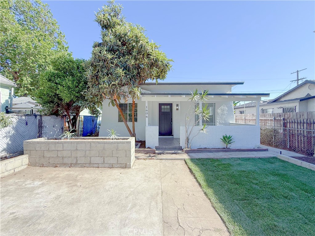 LIVE IN ONE UNIT RENT THE OTHER! Absolutely stunning FULLY REMODELED single family residence right across the street from beautiful Harvard Park! This house is extremely spacious and beautifully laid out with a LARGE DRIVEWAY where you can easily park multiple vehicles! In addition to the 2 bedroom, 2 bathroom main house there is a very large bonus area/living space - 2ND UNIT with its own PRIVATE ENTRANCE which serves as a 1 large bedroom, 1 full bathroom studio with a full SECOND kitchenette! The total amount of square footage of this property is approximately 1,050 sq ft on a large 4,750 square foot lot! As you approach the property you will notice the BRAND NEW SOD AND IRRIGATION SYSTEM! When entering the main house you will notice the gorgeous brand new laminate wood flooring throughout the entire property along brand new tile and vanities in each bathroom. Next you are immediately drawn to the upgraded primary kitchen featuring beautiful quartz countertops and brand new soft close shaker cabinets. Continuing to make your way through the home, you’ll discover each bedroom is very generous in size including the master suite and they all offer an ample amount of closet space. The 2nd unit is also beautifully designed with a full studio setup encompassing a full kitchen and private FULL bathroom! This property is conveniently located near schools, shopping, parks and freeways, this one is definitely a MUST SEE! Priced to sell, it’s going to go quickly so schedule a tour today!