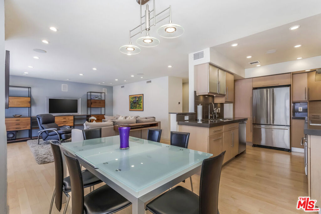 BACK ON MARKET WITH A SPECTACULAR NEW POOL AND SPA DECK! It's time to elevate your lifestyle with this sophisticated and spacious 1BR/1BA condo in the heart of West Hollywood. This extra-large top-floor corner unit has been tastefully renovated with high-end materials and modern design for elevated urban living. Bright and inviting with warm wood floors, a fireplace with stainless-steel surround, and an easy, open layout, this is the perfect place for relaxing or entertaining. Over $40,000 in luxury upgrades provide convenience and comfort including a built-in sound system with individual room controls, reverse osmosis water filtration system, Nest thermostat, Wolf kitchen appliances, Miele in-unit laundry and double-paned windows. There's plenty of room for your clothes, your shoes, your sporting equipment and whatever else you need space for in the brilliantly designed custom closets. The gourmet kitchen is outfitted with stone countertops, generous cabinet space and an appliance garage to tuck away your kitchenware and keep away the clutter. A renovated bathroom includes a separate shower and bath. Imagine sipping your morning coffee on your sunny balcony overlooking the sparkling new pool! Need more storage? You have two additional storage spaces in the secured garage. The Butterfly entry system enhances your security. Turnkey, refined, and ready for its next owner, this home offers the ultimate in urban living in an unbeatable WeHo location near dining, shopping, and nightlife.