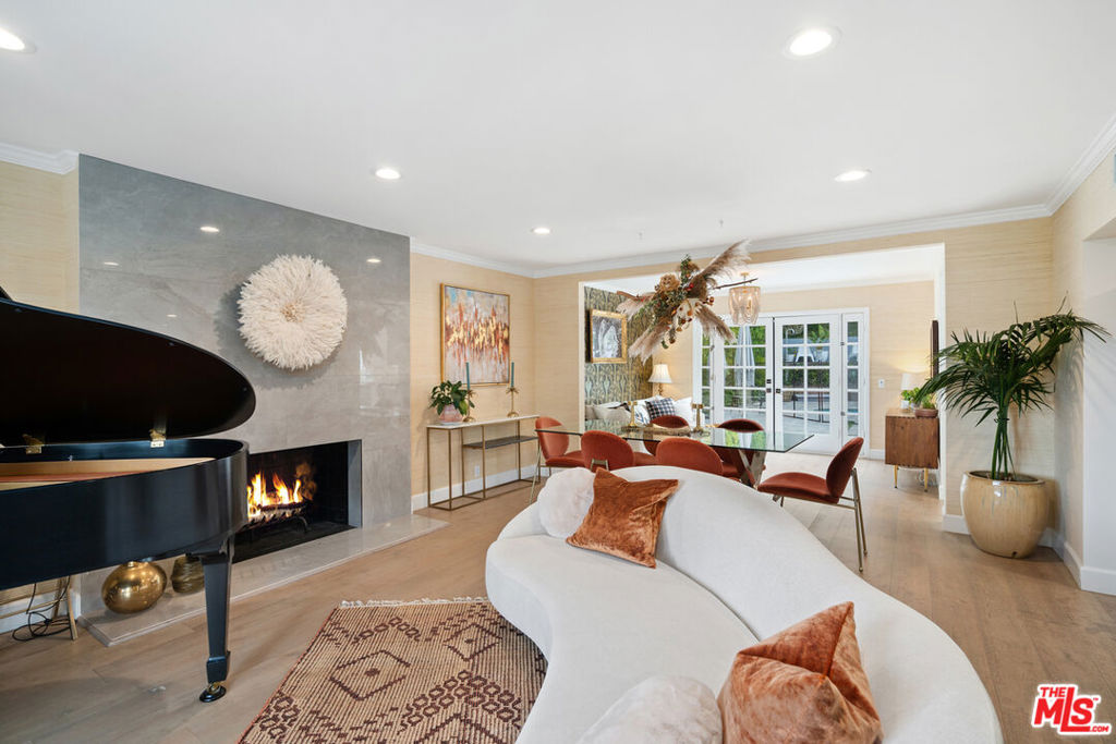 Nestled in the scenic Hollywood Hills, this property epitomizes the perfect retreat, offering a serene ambiance and modern comforts. With a touch of Colonial charm, it sits gracefully amidst the rolling hills of Studio City, boasting five bedrooms and three bathrooms spread across 3,000 square feet. Hardwood flooring, ample windows, and skylights infuse every corner with natural light, creating an inviting atmosphere.The heart of this home is its spacious kitchen, equipped with Viking appliances and a cozy breakfast nook. Flowing seamlessly from the living, dining, and den areas is an expansive backyard oasis, complete with an outdoor BBQ area, oversized pool, and spaideal for relaxation and entertainment.Highlighted by a vibrant pink bar, the space exudes whimsical charm and moments of leisure. Noteworthy finishes include Grohe and Hansgrohe plumbing fixtures, Kohler sinks and tubs, and Toto and Viking appliances, ensuring both luxury and functionality. Beyond its tranquil setting, this property boasts proximity to Hollywood studios, iconic landmarks, and the prestigious Beverly Hills. It's also conveniently situated near the Silver Triangle and the bustling Farmers Market, offering residents easy access to local amenities and vibrant city life.With its warmth and comfort, this home is perfect for seasonal stays in Los Angeles, capturing the essence of modern California living amidst natural beauty and urban convenience.