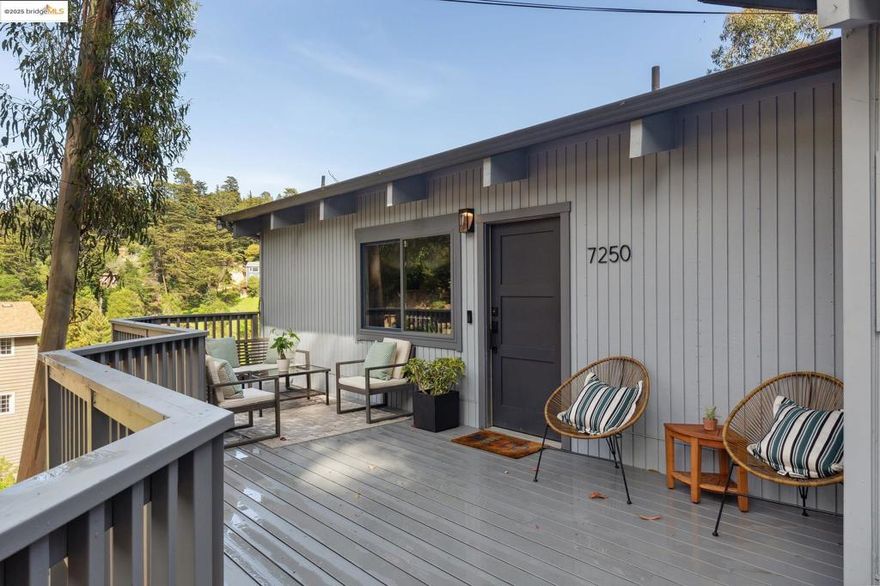 Tucked amid the trees, this modern rustic home blends natural beauty with thoughtful updates. Upon entry, soaring wood beam ceilings and open, light filled spaces set an inviting tone. Just off the foyer, a versatile alcove offers endless possibilities such as a home office, reading nook, den, or media lounge.  Wide plank European oak floors flow throughout the main level, complementing the home’s warm, organic aesthetic. The living room centers around a striking rock fireplace and serene woodland views, creating the perfect place to unwind.  The remodeled kitchen combines form and function with abundant cabinetry, expansive counter space, and open shelving that adds both style and utility. Bedrooms are generously sized and well separated for privacy, with two offering en suite layouts ideal for guests or multi generational living.  Multiple decks extend the living space outdoors, perfect for morning coffee among the trees or evening gatherings surrounded by nature. Just a 4 minute drive from Montclair Village and moments from the scenic Railroad Trail, this home offers a rare blend of tranquility, character, and convenience.