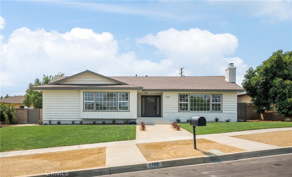 Say hello to your new home. This fully remodeled single-story Upland retreat blends designer style with thoughtful functionality—inside and out. Spanning just under 2,500 square feet, this 4-bedroom, 3.5-bathroom home offers elevated living with custom finishes throughout. Step inside to wide-plank wood flooring and a light-filled open layout that flows effortlessly from room to room. The stunning chef’s kitchen features semi-custom black and white oak cabinetry, quartz countertops, stainless steel appliances, a built-in range hood, and a pot filler—all designed with form and function in mind.
The spacious primary suite features a walk-in closet and a serene, spa-like bathroom. Each additional bedroom offers flexibility for guests, family, or a home office. Every bathroom has been beautifully reimagined with high-end tile, modern fixtures, and curated design details. A custom mudroom and oversized laundry room with a massive storage closet add everyday convenience and functionality. Outdoors, enjoy fresh landscaping, all-new hardscape, and a sparkling resurfaced pool with new plaster and tile. The fully permitted pool house includes a half bath—perfect for entertaining or creating a serene guest space. The oversized two-car garage offers extra space for a workshop, home gym, or storage. Additional upgrades include a newer HVAC system, plumbing, electrical panel, tankless water heater, and furnace. Nestled in a prime Upland neighborhood near top-rated schools, parks, walking trails, shopping, and the 210 freeway—this home truly has it all. Don’t miss your chance to own this turnkey designer home—schedule a private showing today.