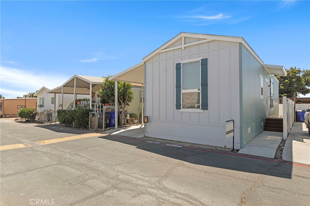 This brand-new Clayton-manufactured home features 2 bedrooms and 2 bathrooms, with approximately 660 square feet of modern living space. Step into contemporary comfort with this beautifully designed 2025 home, which is move-in ready and built to impress. The stylish kitchen boasts soft-close shaker-style cabinets complemented by sleek black hardware, quartz countertops, and a classic white subway tile backsplash. It comes equipped with brand-new stainless-steel appliances, including a washer and dryer. The open-concept layout enhances the flow between the kitchen, dining, and living areas, making it ideal for everyday living and entertaining. Both bathrooms are designed with matte black fixtures, maintaining the home's modern aesthetic. Additional features include a smart thermostat, central air and heating, dual-pane windows for improved energy efficiency, and a Ring doorbell for added security. This is a fantastic opportunity to own a brand-new, turnkey home with all the contemporary amenities you've been searching for.