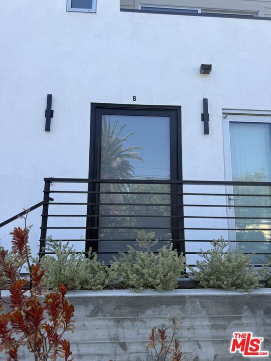 Beautiful rooftop with BBQ and shaded solar panel section.