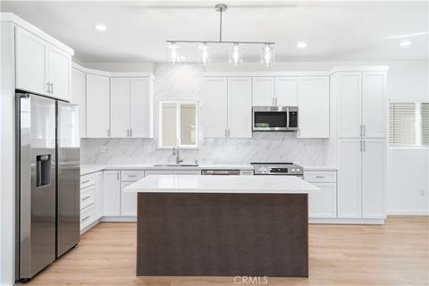 Photo of 21003 Longworth, Lakewood, CA 90715 (MLS # OC26087208)